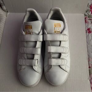 Adidas Stan Smiths Mens White Sneakers with Gold Lettering and Velcro Straps